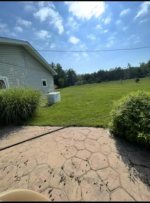 Exterior - 10845 Long Rapids Rd, Lachine, MI 49753 photo 2 of 10