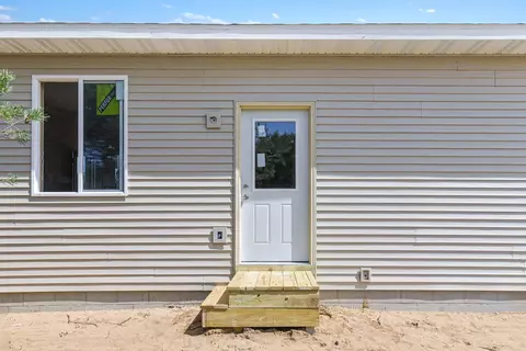 Exterior - 8509 Grant Rd, Mancelona, MI 49659 photo 2 of 5