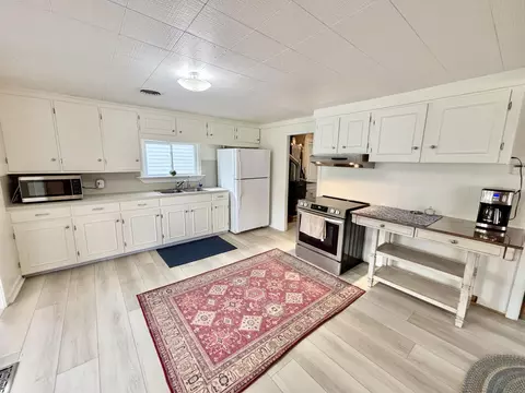 Kitchen - 1065 N Abbe Rd, Fairview, MI 48621 photo 5 of 6
