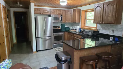 Kitchen - 11809 Bear Track Trl, Frederic, MI 49733 photo 3 of 3