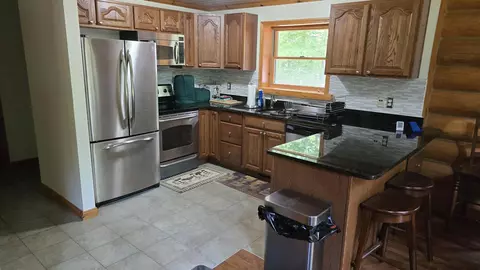 Kitchen - 11809 Bear Track Trl, Frederic, MI 49733 photo 2 of 3