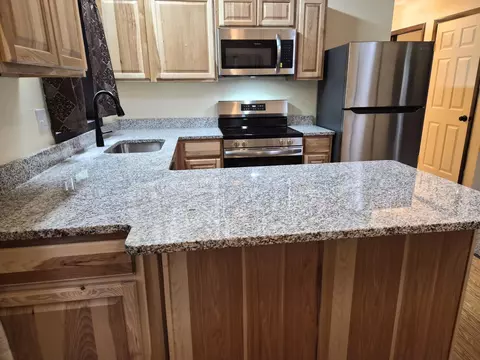 Kitchen - 208 E Loves Dr, Roscommon, MI 48653 photo 3 of 11