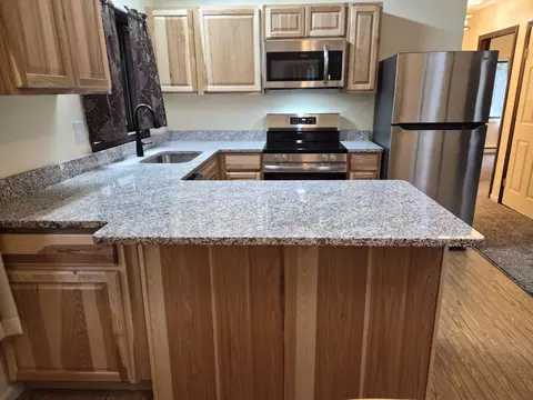 Kitchen - 208 E Loves Dr, Roscommon, MI 48653 photo 2 of 11