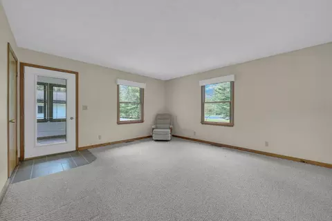 Living - 1758 Dewitt Trl, Roscommon, MI 48653 photo 4 of 6