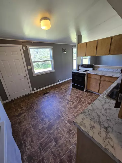 Kitchen - 1989 Betsy Blvd, Fairview, MI 48621 photo 2 of 2