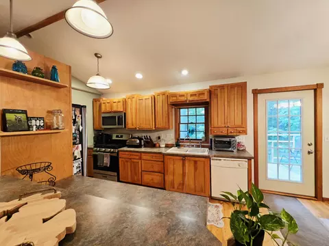 Kitchen - 9535 E Sunset Dr, Roscommon, MI 48653 photo 2 of 3