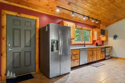 Kitchen - 19609 Mcintire Rd, Comins, MI 48619 photo 2 of 3
