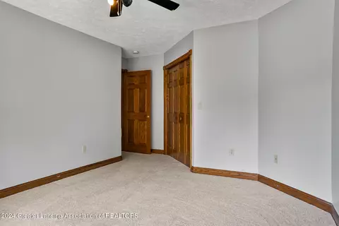 Bedroom - 11108 Eden Trl, Eagle, MI 48822 photo 12 of 13