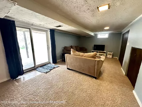 Living - 1218 Redpole Dr, Dewitt, MI 48820 photo 5 of 6