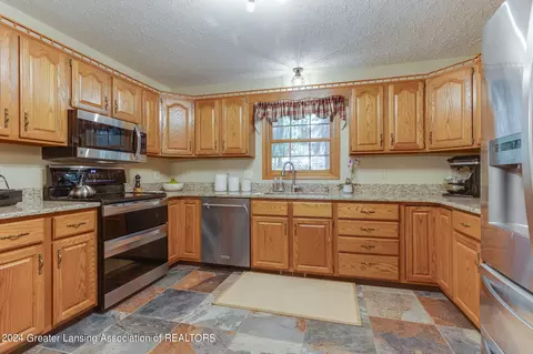Kitchen - 3933 W Herbison Rd, Dewitt, MI 48820 photo 2 of 3