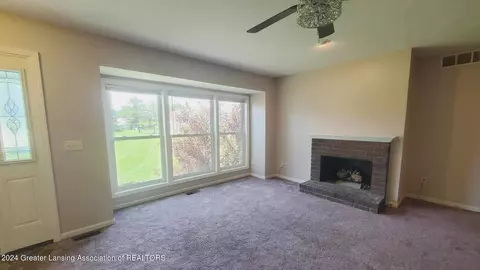 Living - 7230 Creekside Dr, Lansing, MI 48917 photo 2 of 2