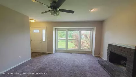 Living - 7230 Creekside Dr, Lansing, MI 48917 photo 1 of 2