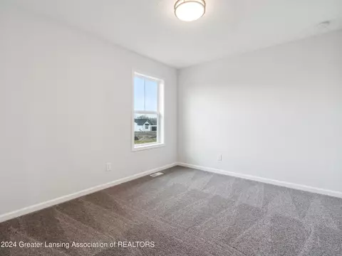 Bedroom - 621 Launch Point Dr, Perry, MI 48872 photo 12 of 13