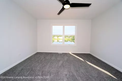 Bedroom - 621 Launch Point Dr, Perry, MI 48872 photo 2 of 13