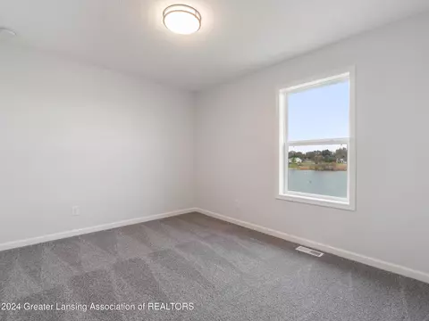Bedroom - 621 Launch Point Dr, Perry, MI 48872 photo 10 of 13