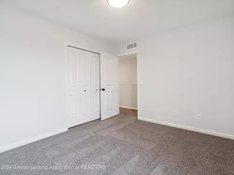 Bedroom - 621 Launch Point Dr, Perry, MI 48872 photo 13 of 13