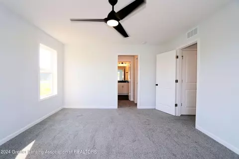 Bedroom - 621 Launch Point Dr, Perry, MI 48872 photo 1 of 13