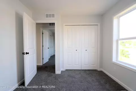 Bedroom - 621 Launch Point Dr, Perry, MI 48872 photo 6 of 13