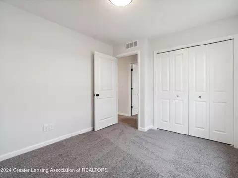 Bedroom - 621 Launch Point Dr, Perry, MI 48872 photo 11 of 13