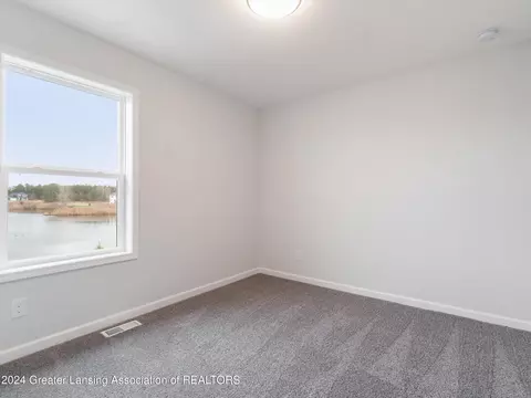 Bedroom - 621 Launch Point Dr, Perry, MI 48872 photo 7 of 13