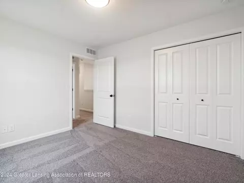 Bedroom - 621 Launch Point Dr, Perry, MI 48872 photo 8 of 13