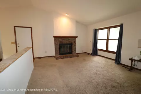 Living - 2404 Pine Tree Rd, Holt, MI 48842 photo 2 of 3