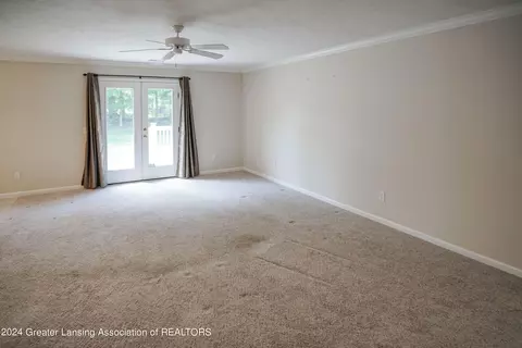 Living - 7745 Taragreen Dr, Lansing, MI 48917 photo 4 of 5