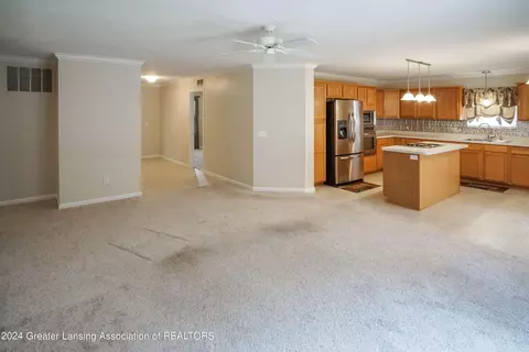 Living - 7745 Taragreen Dr, Lansing, MI 48917 photo 3 of 5