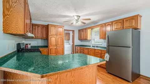 Kitchen - 5501 E Haskell Lake Rd, Harrison, MI 48625 photo 2 of 3