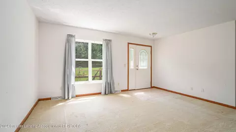 Living - 5501 E Haskell Lake Rd, Harrison, MI 48625 photo 3 of 4