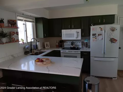 Kitchen - 100 E Haslett Rd, Haslett, MI 48840 photo 2 of 3