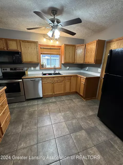 Kitchen - 312 E Cavanaugh Rd, Lansing, MI 48910 photo 2 of 2