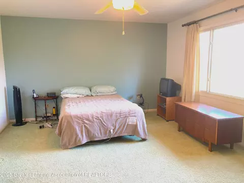 Bedroom - 912 Grenoble Dr #E, Lansing, MI 48917 photo 2 of 3
