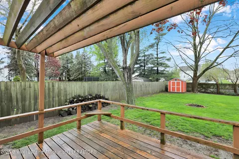 Exterior - 910 Pecos Dr, Lansing, MI 48917 photo 5 of 7