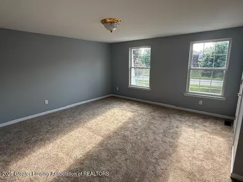 Living - 6328 Beechfield Dr, Lansing, MI 48911 photo 3 of 4