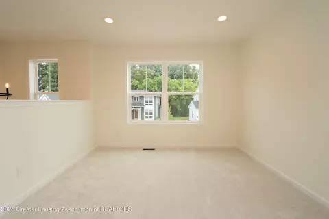 Living - 612 Titanium Trl, Haslett, MI 48840 photo 4 of 4