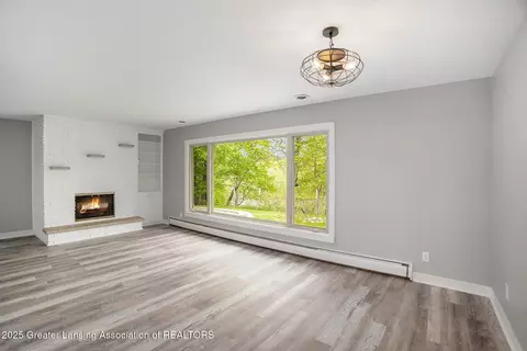 Living - 11958 Eden Trl, Eagle, MI 48822 photo 3 of 7