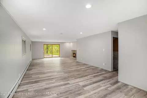 Living - 11958 Eden Trl, Eagle, MI 48822 photo 6 of 7