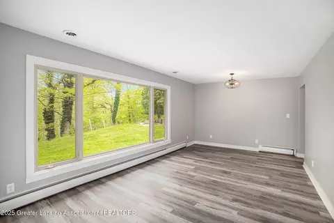 Living - 11958 Eden Trl, Eagle, MI 48822 photo 2 of 7