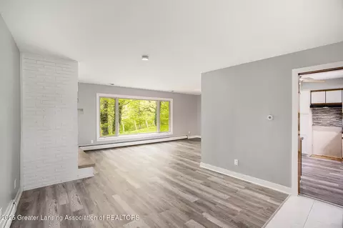 Living - 11958 Eden Trl, Eagle, MI 48822 photo 1 of 7
