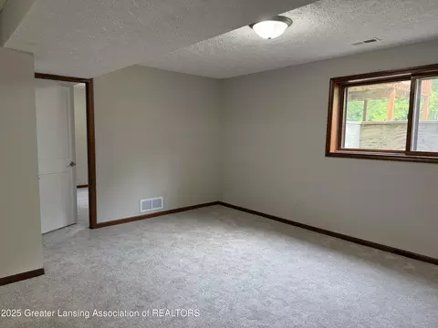 Bedroom - 1210 Wolf Run Dr, Lansing, MI 48917 photo 4 of 5