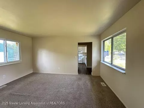 Living - 3619 Coachlight Common St, Lansing, MI 48911 photo 2 of 3