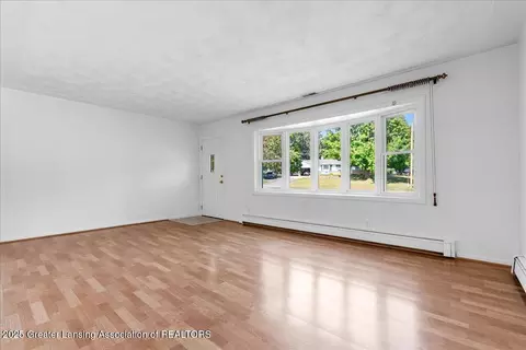 Living - 1122 E Geneva Dr, Dewitt, MI 48820 photo 2 of 5