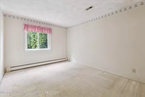 Bedroom - 15480 Boichot Rd, Lansing, MI 48906 photo 8 of 9