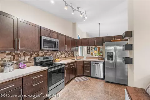 Kitchen - 6923 Springtree Ln #143, Lansing, MI 48917 photo 1 of 2
