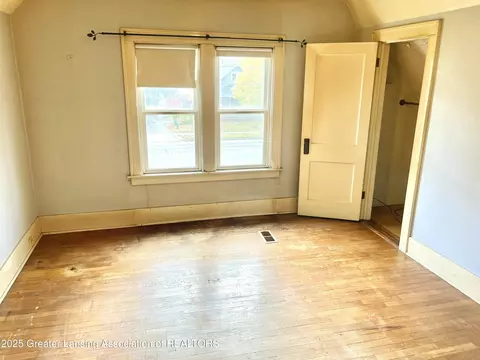 Bedroom - 713 E Cavanaugh Rd, Lansing, MI 48910 photo 3 of 4