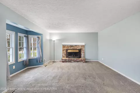 Living - 416 Riverview Dr, Dewitt, MI 48820 photo 2 of 5