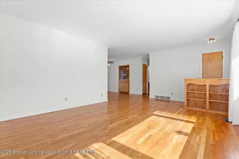 Living - 1448 Primrose Ln, Dewitt, MI 48820 photo 2 of 2