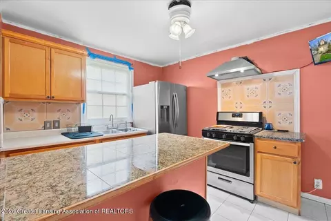 Kitchen - 306 E Cavanaugh Rd, Lansing, MI 48910 photo 3 of 3