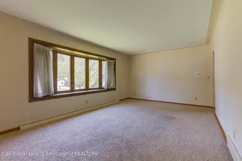 Living - 15178 Chetwyn Dr, Lansing, MI 48906 photo 1 of 2